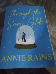 Through the Snow Globe: A Charming and Uplifting Holiday Read by Annie Rains